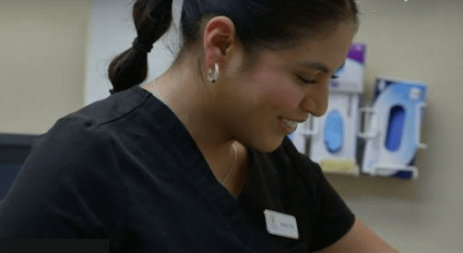 Healthcare professional comforting a patient, representing whole-person care and faith-based healing